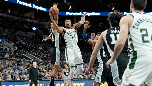 Jan 4, 2024; San Antonio, Texas, USA; Milwaukee Bucks forward Giannis Antetokounmpo (34) between San Antonio Spurs forward Dom Barlow (26) and guard Devin Vassell (24) during the first half at Frost Bank Center.